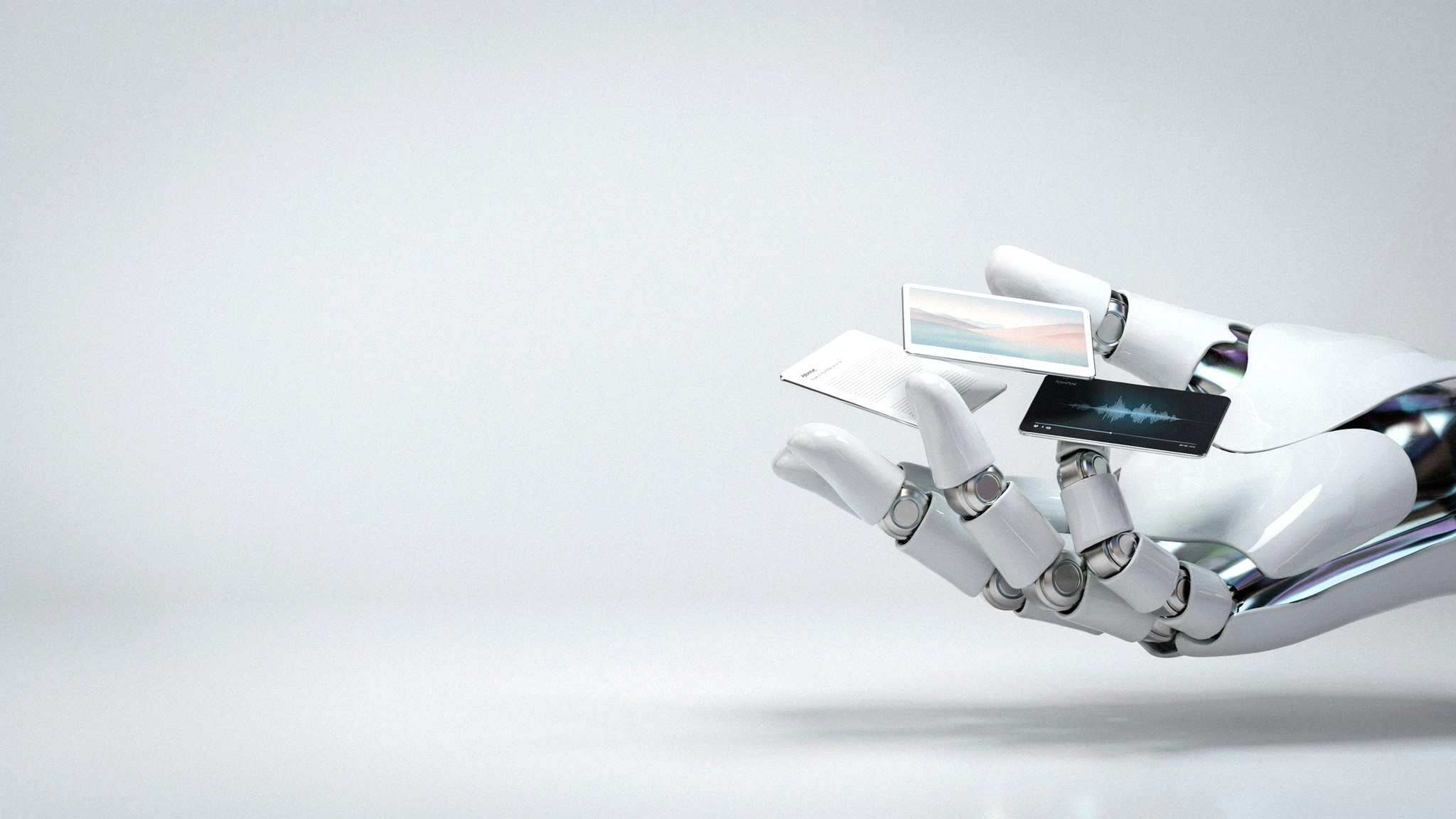 Robotic hand arranging photo, text and video cards — content creation agency, Johannesburg