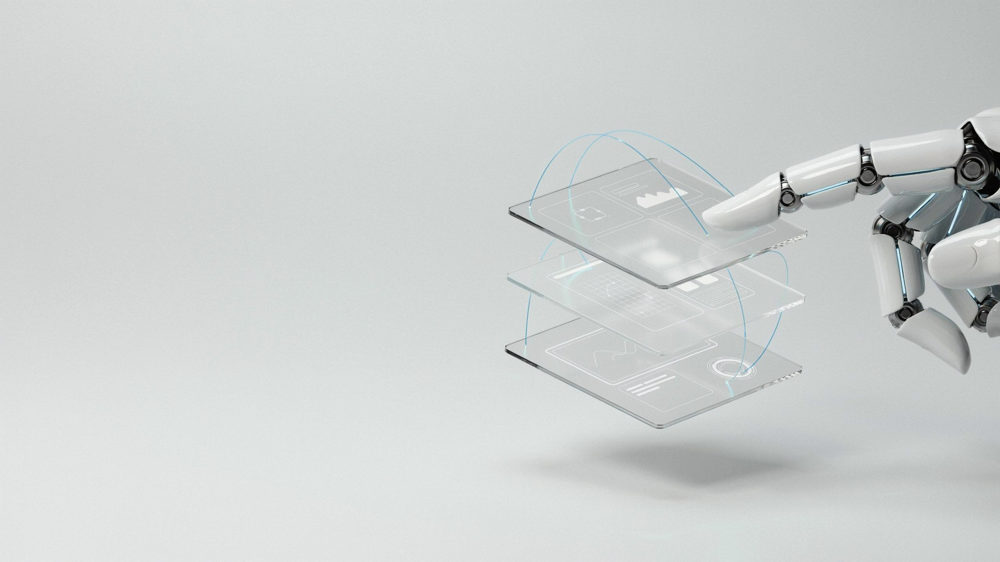 Robotic fingertip on a stack of UI wireframes — user experience design, Johannesburg